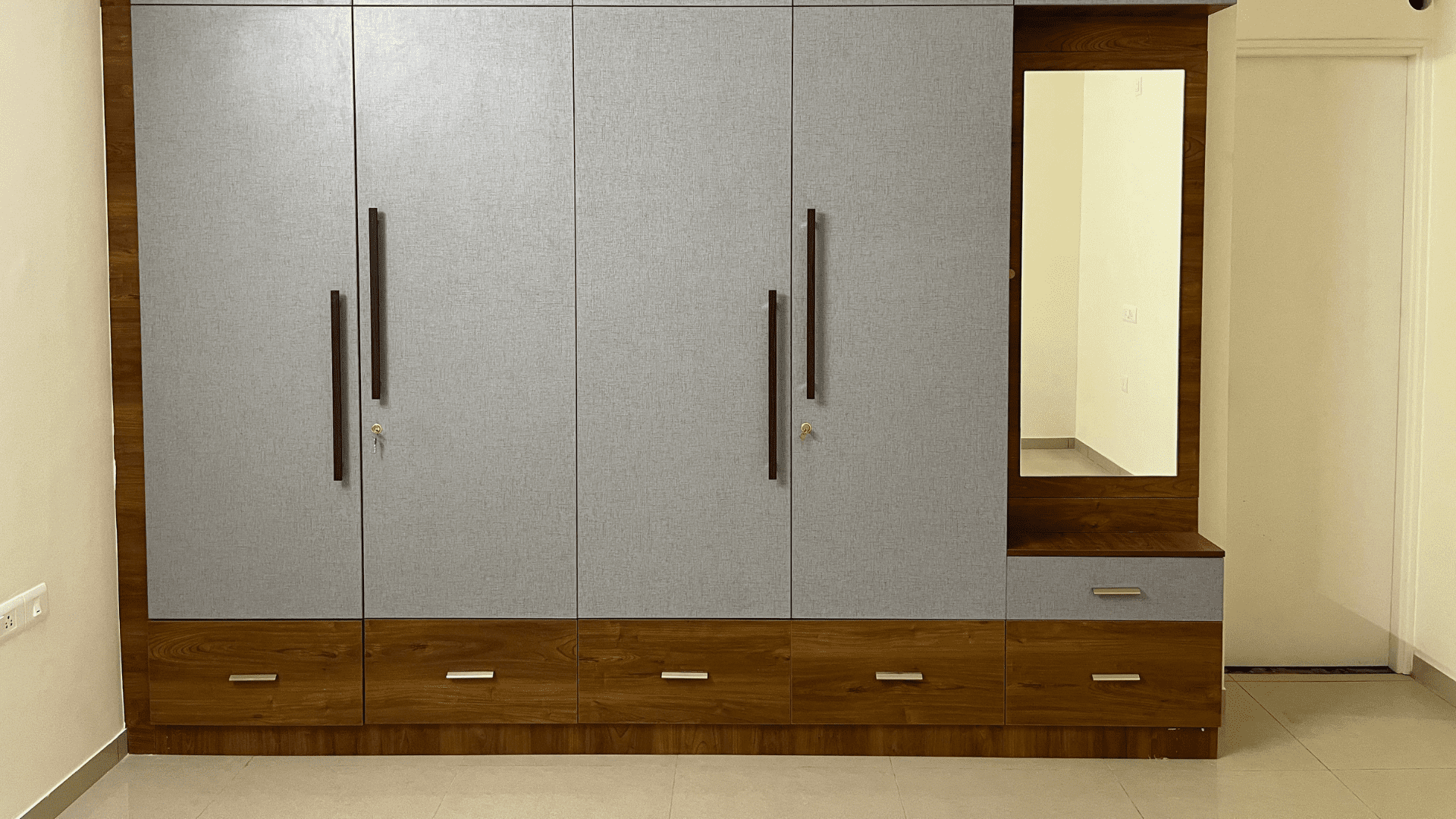 Walk-in closet with organized shelves in Prarshuram Residence